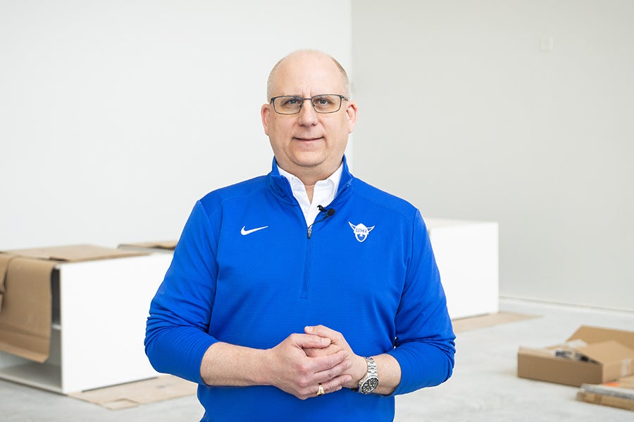 President Brad Chamberlain portrait in Gerdin Fieldhouse under construction