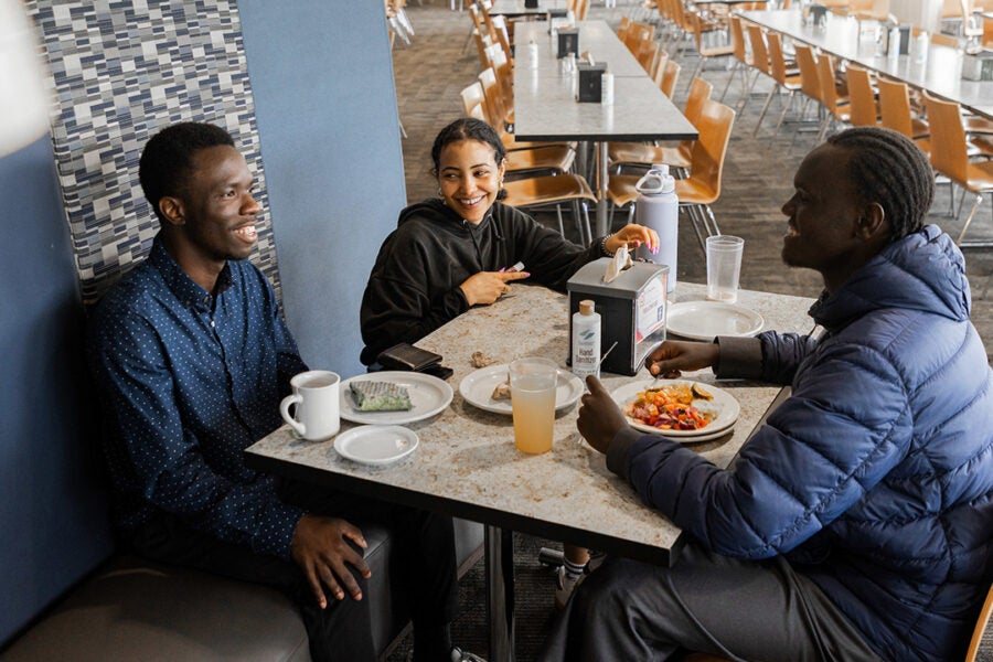 students enjoy breakfast