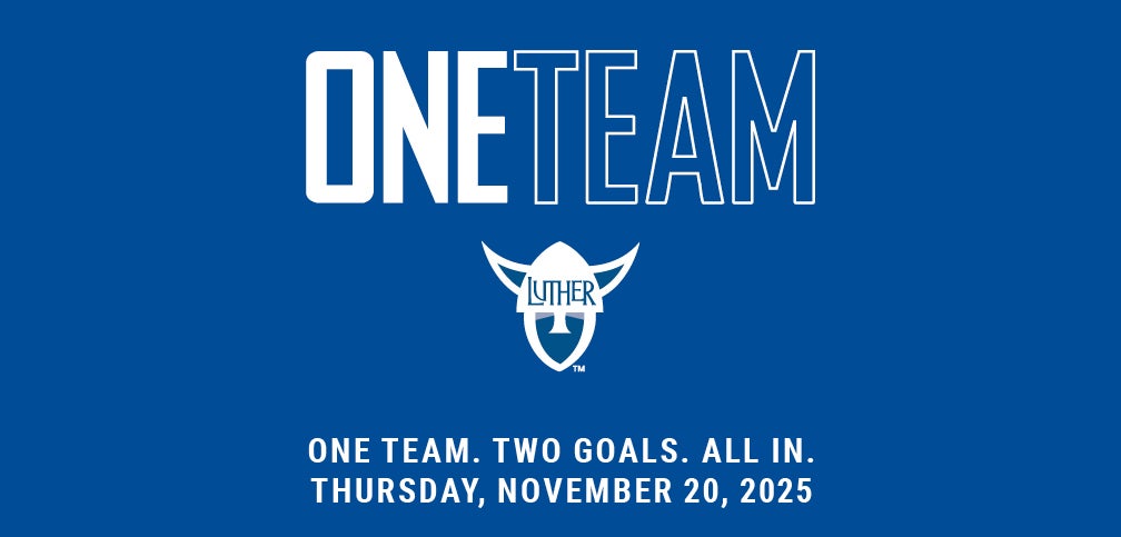 the team gathers in a circle, hands joined