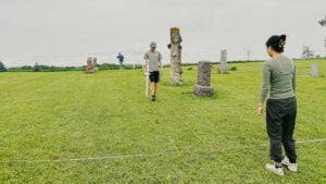 college students use gradiometer in pioneer cemetery