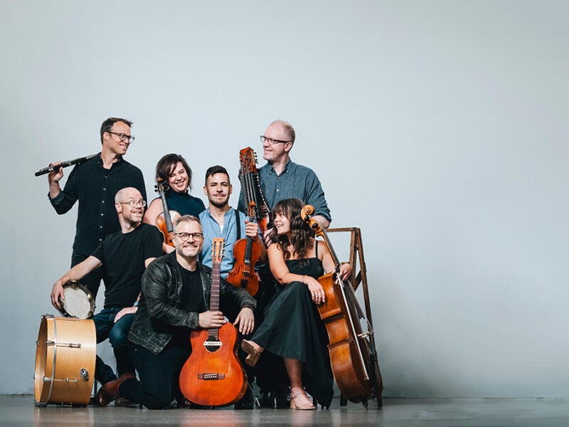 musicials holding strings instruments