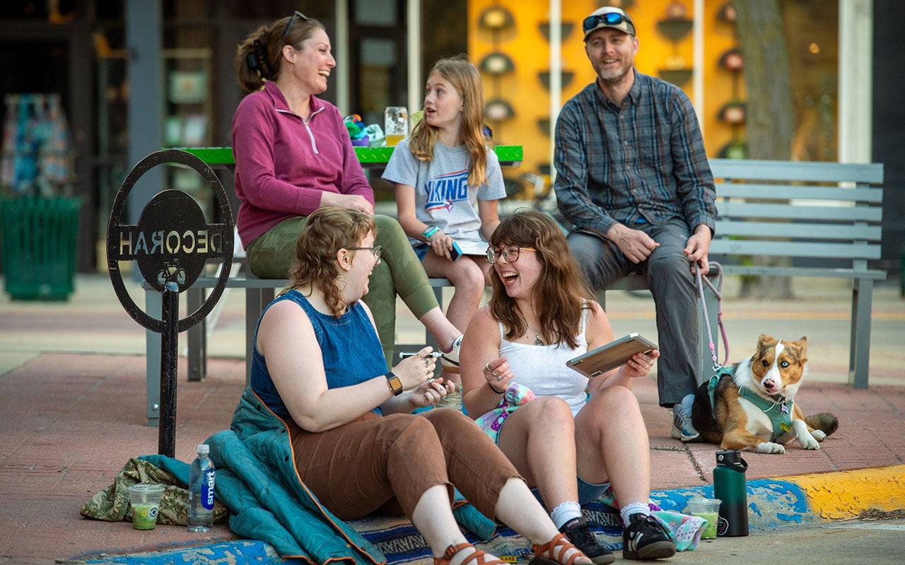 Five people and a dog attending trivia night in downtown Decorah.