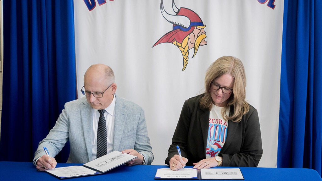 Luther College President Brad Chamberlain (left) and Decorah Community School District Board of Education President Cindy Goodner