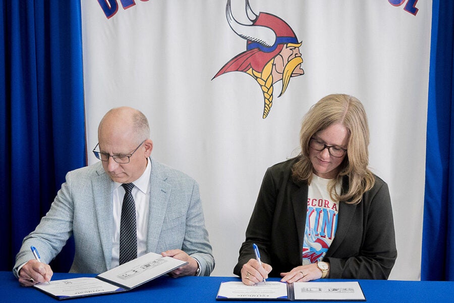 Luther College President Brad Chamberlain (left) and Decorah Community School District Board of Education President Cindy Goodner