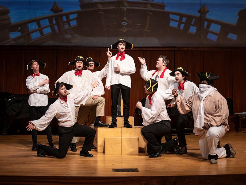 group of Luther students acting in a theatre performance