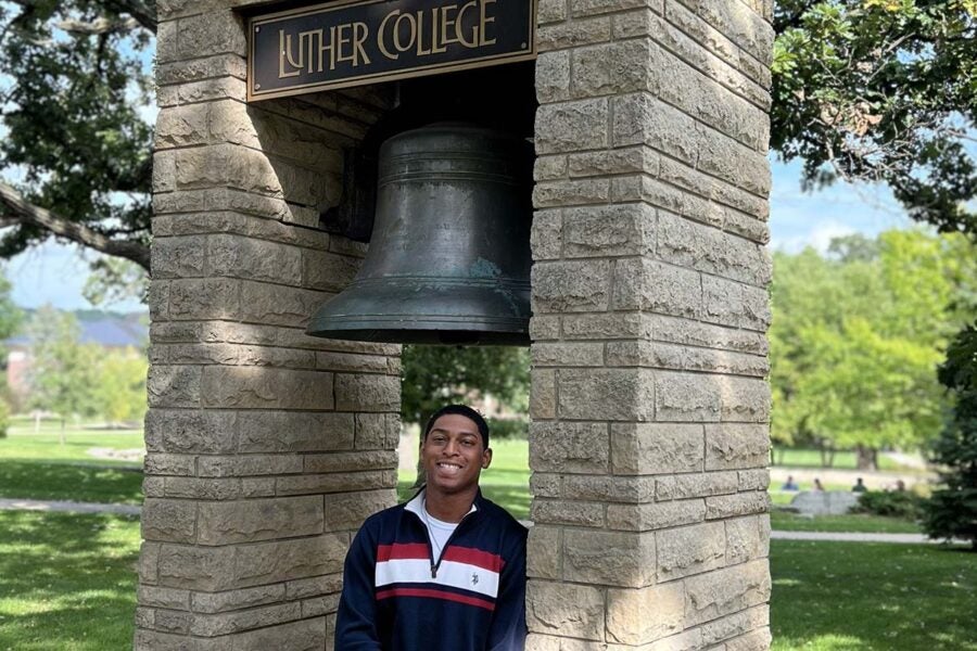 Geremiah Brown stands under the Luther Bell.