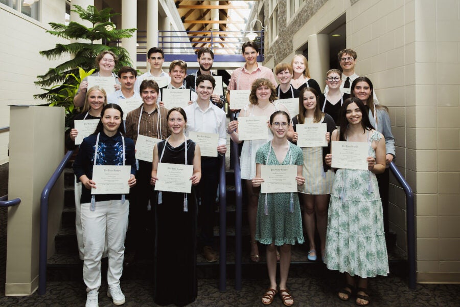 Luther College's Phi Beta Kappa members hold up certificates for a group photo