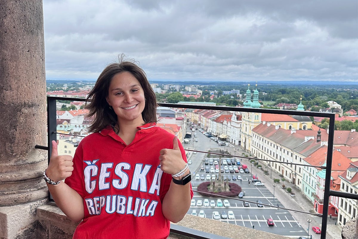 a college student poses for a photo from the lookout of the White Tower in the city Hradec Králové in the Czech Republic.