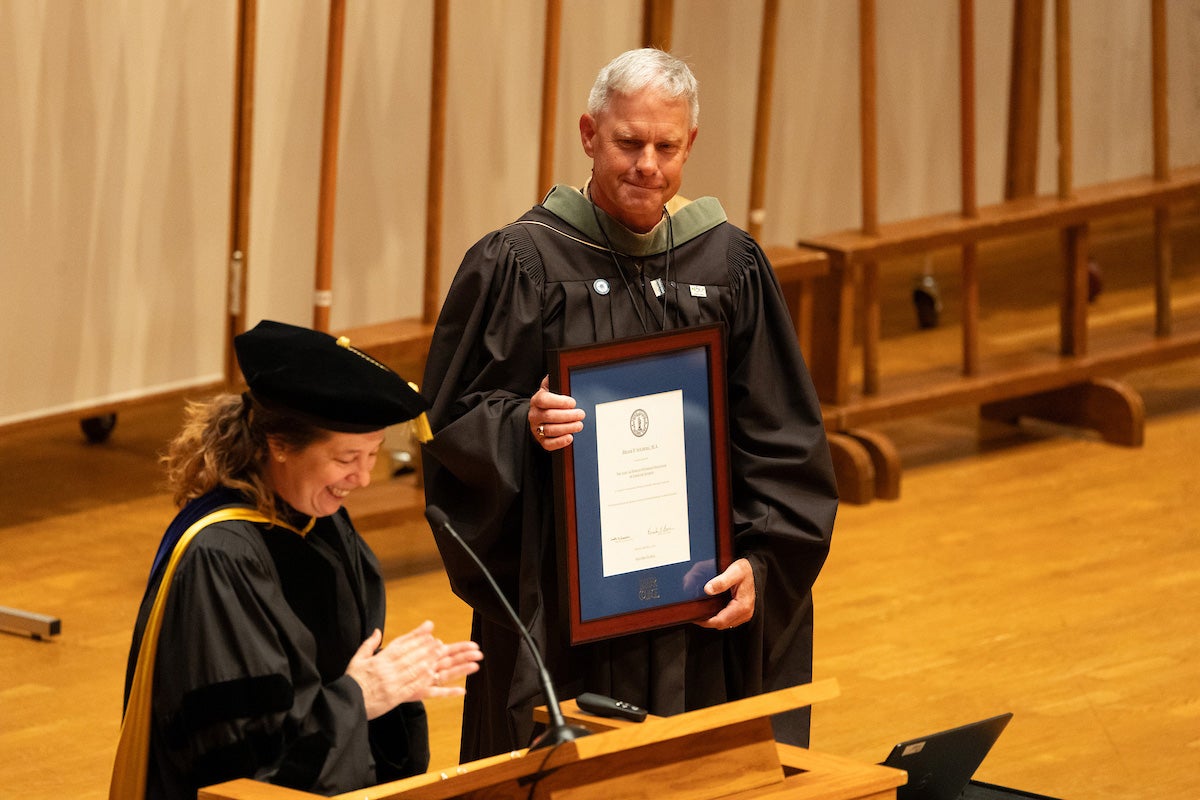 Provost Pam Bacon presents distinguished professorship citation to Professor Brian Solberg