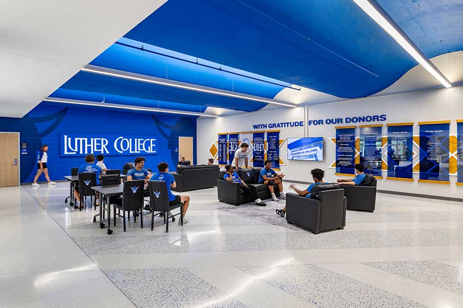 A lounge area with several students gathered in it