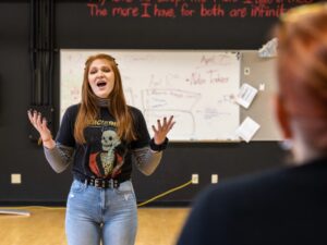 Woman auditioning for theater scholarship.