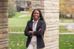 Luther College student Rejoice Mzumara stands for a professional portrait
